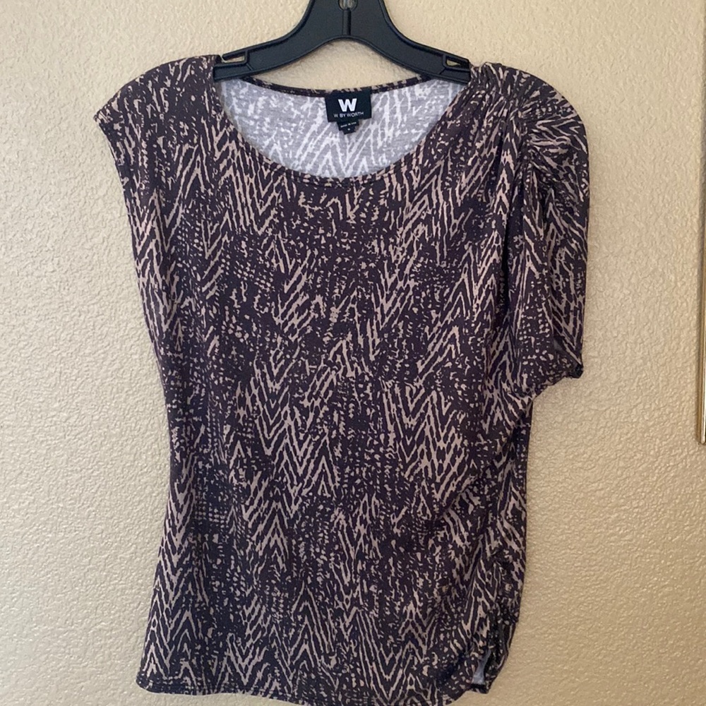 Cute asymmetrical sleeve length.  Batik pattern vibe with brown and tan.